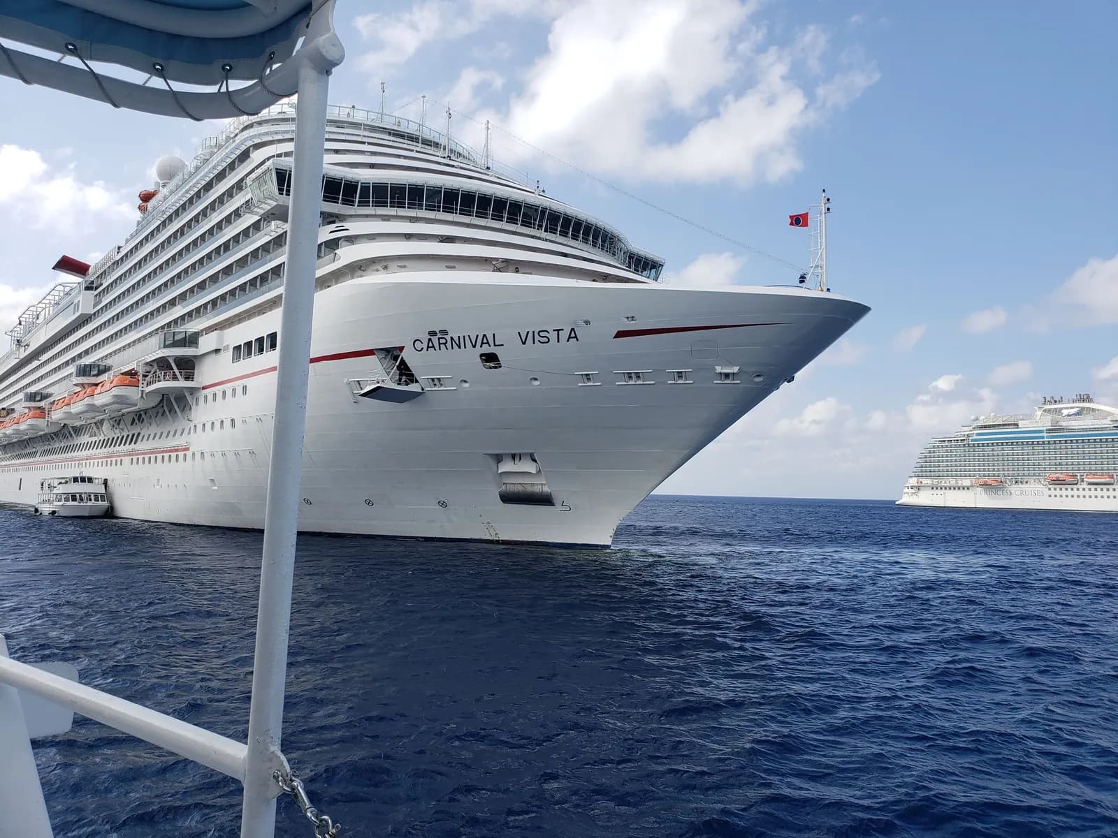 Carnival Vista anchored in the Caribbean, seen from a tender boat